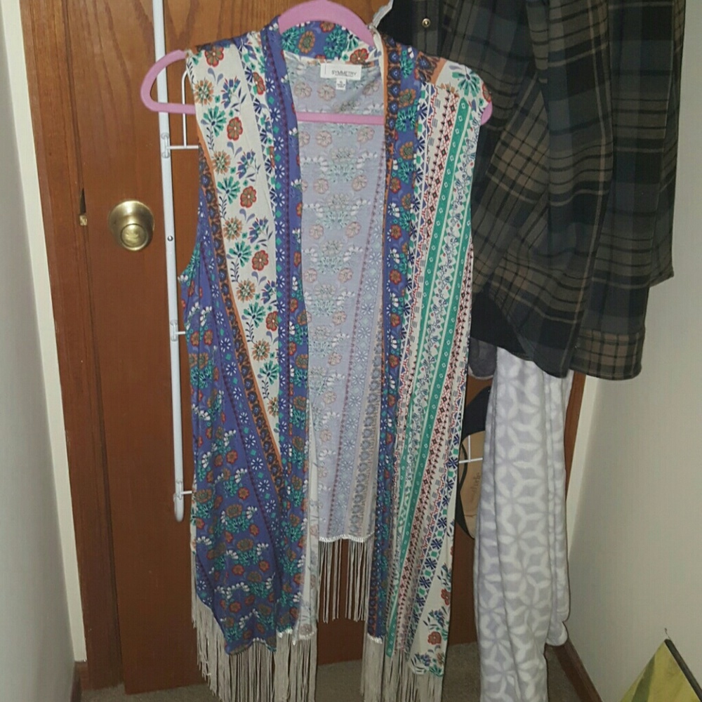 Sleeveless cardigan? Lol idk what to call it.